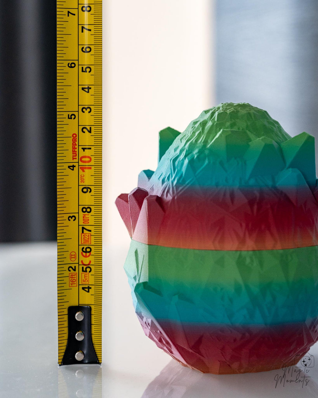 Dragon egg container next to measuring tape for scale