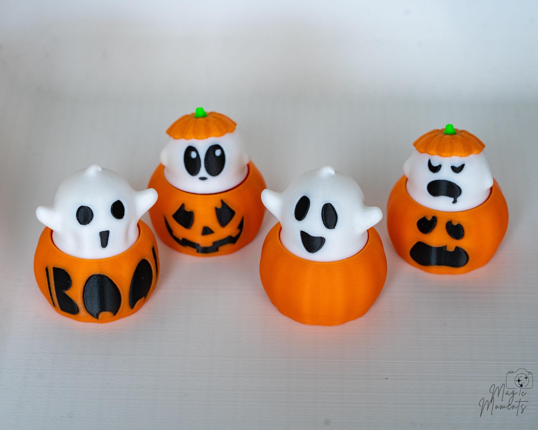 Cute ghost pumpkin figures displayed together