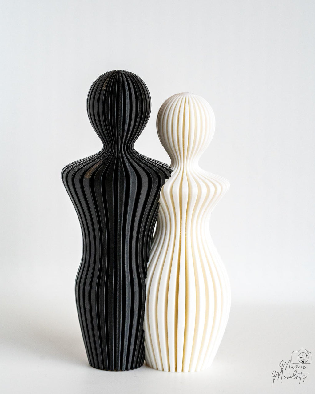 3D printed couple sculptures in black and white colours