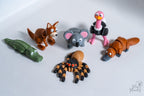 Set of animals figurines including a crocodile, kangaroo, koala, ostrich, spider and platypus.