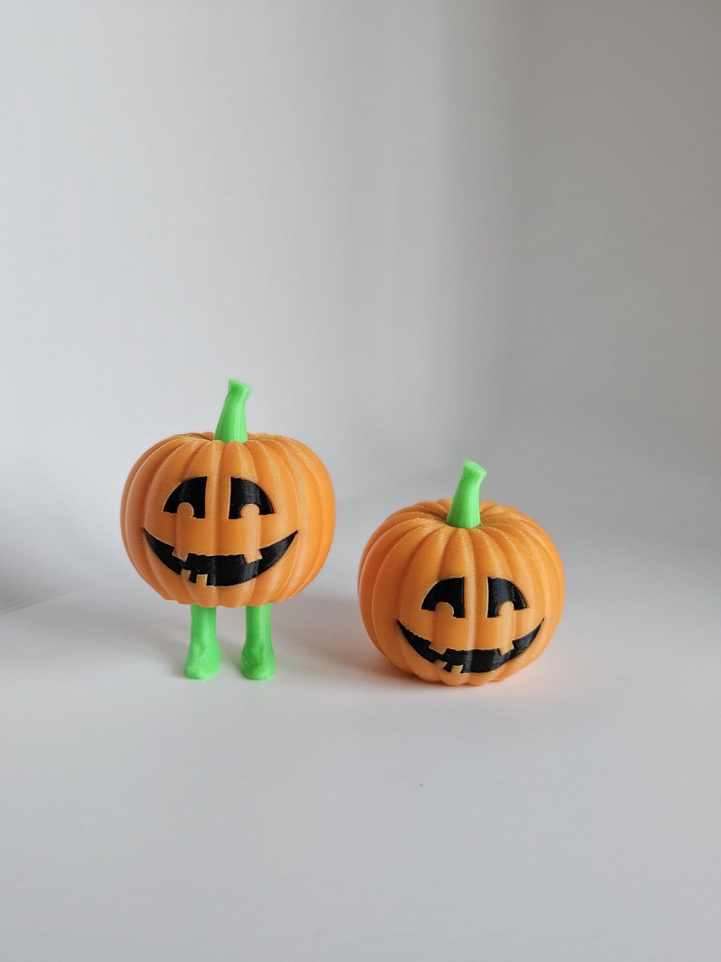 Cute Halloween pumpkin figures with smiling faces