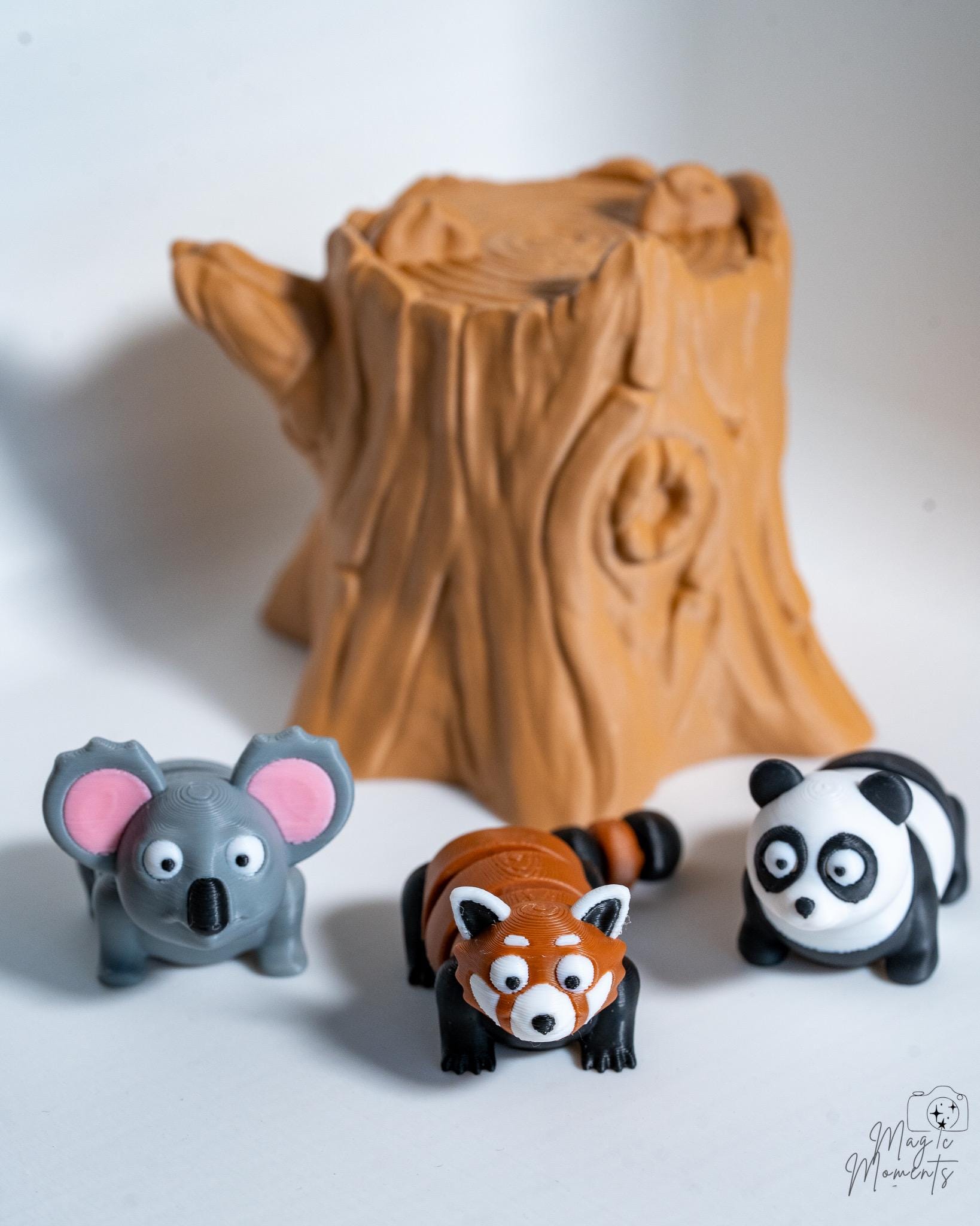 Woodland animal figures with tree stump decoration