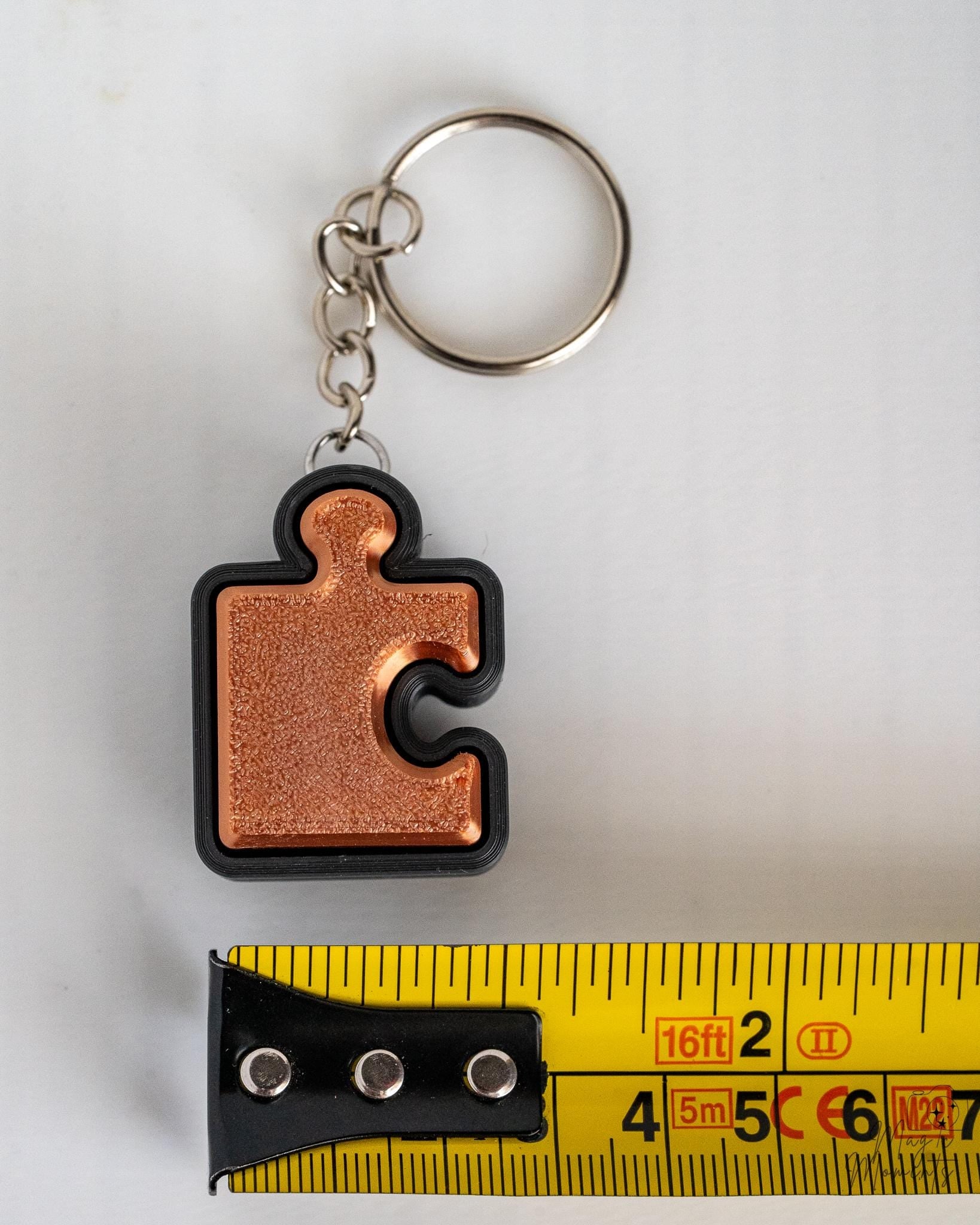 bronze puzzle piece fidget clicker