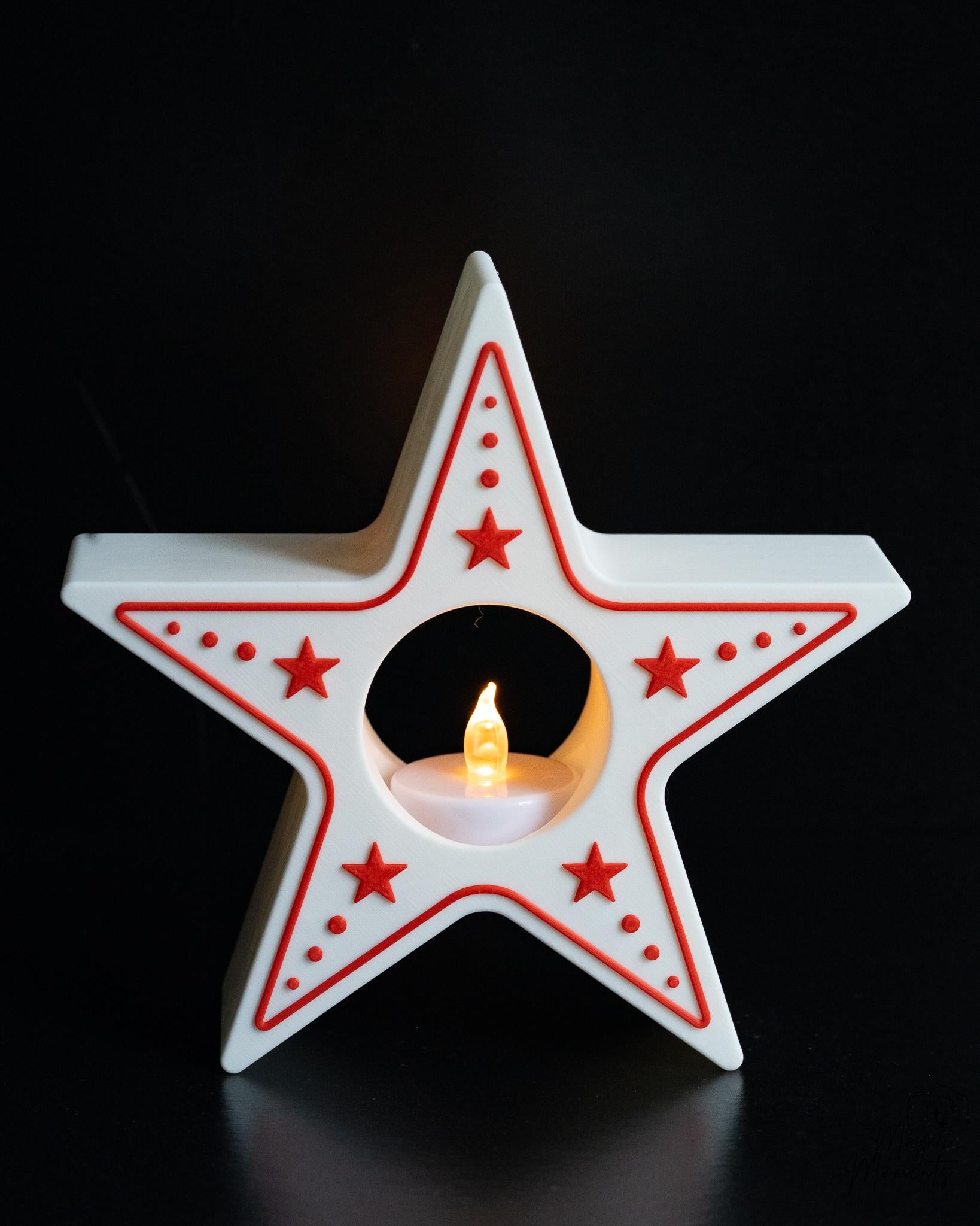 Star-shaped candle holder with red accents on a black background
