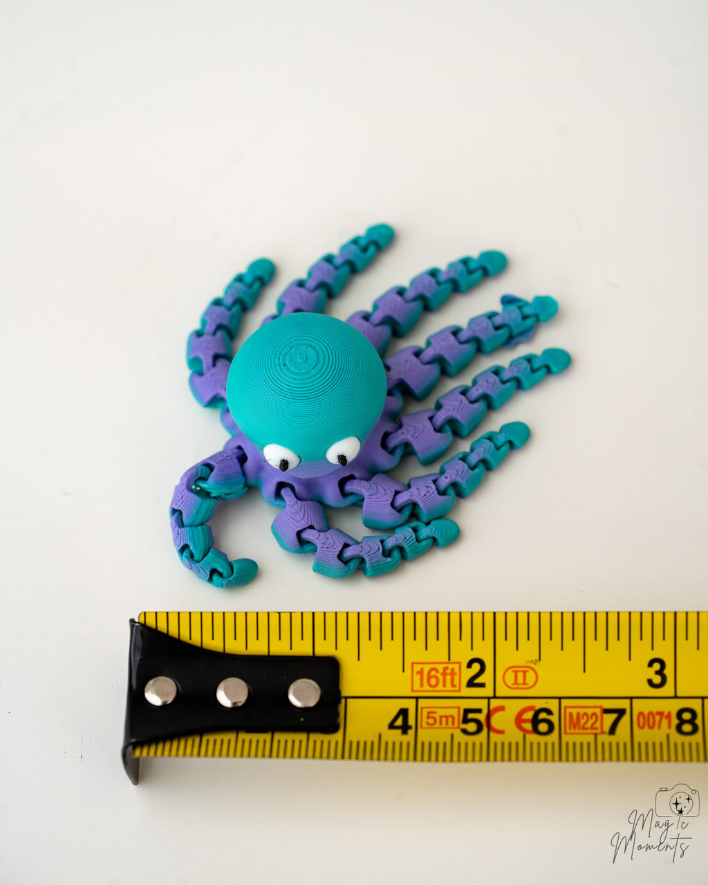octopus figurine with a measuring tape for scale 