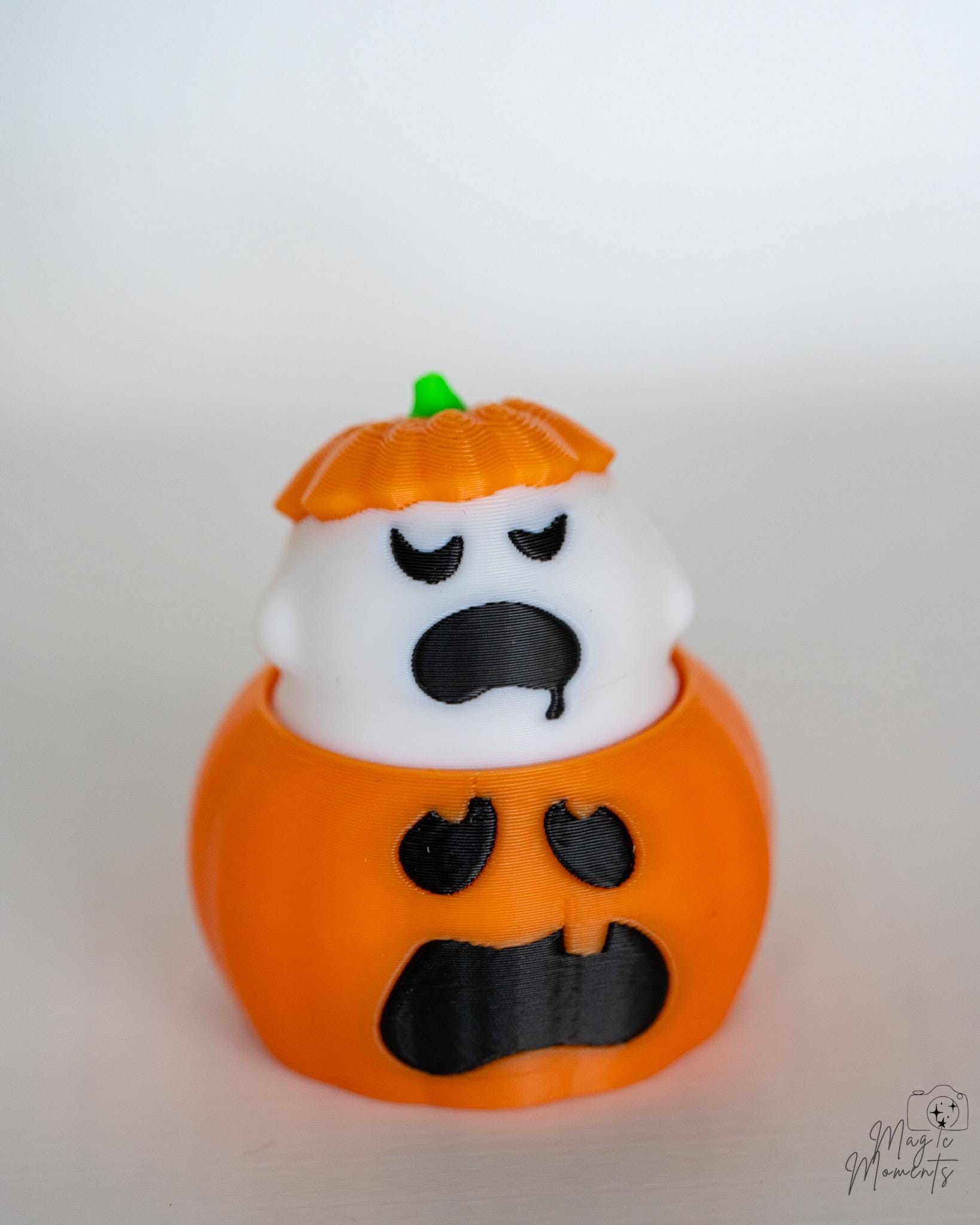 Ghost pumpkin clickers with different facial expressions
