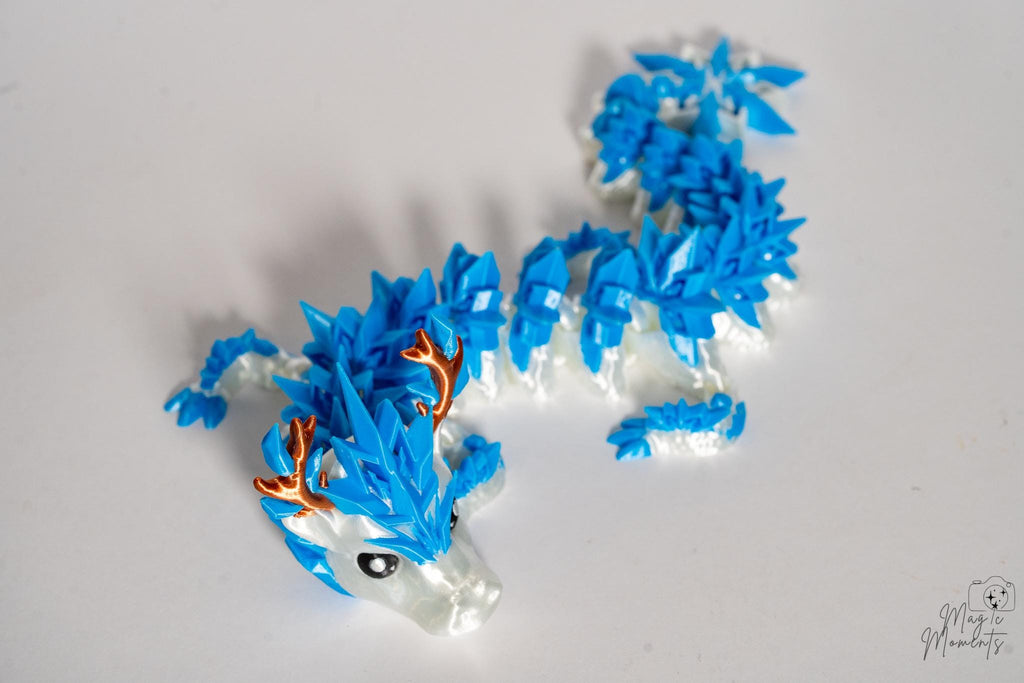 Winter dragon figure with crystal style spikes and icy colour palette