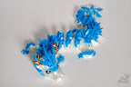Winter dragon figure with crystal style spikes and icy colour palette
