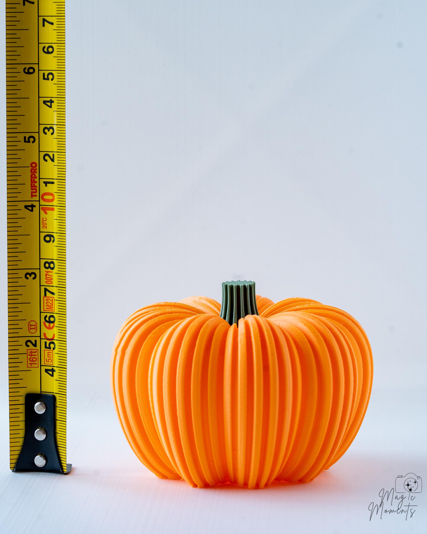 orange ribbed pumpkin next to measuring tape for scale