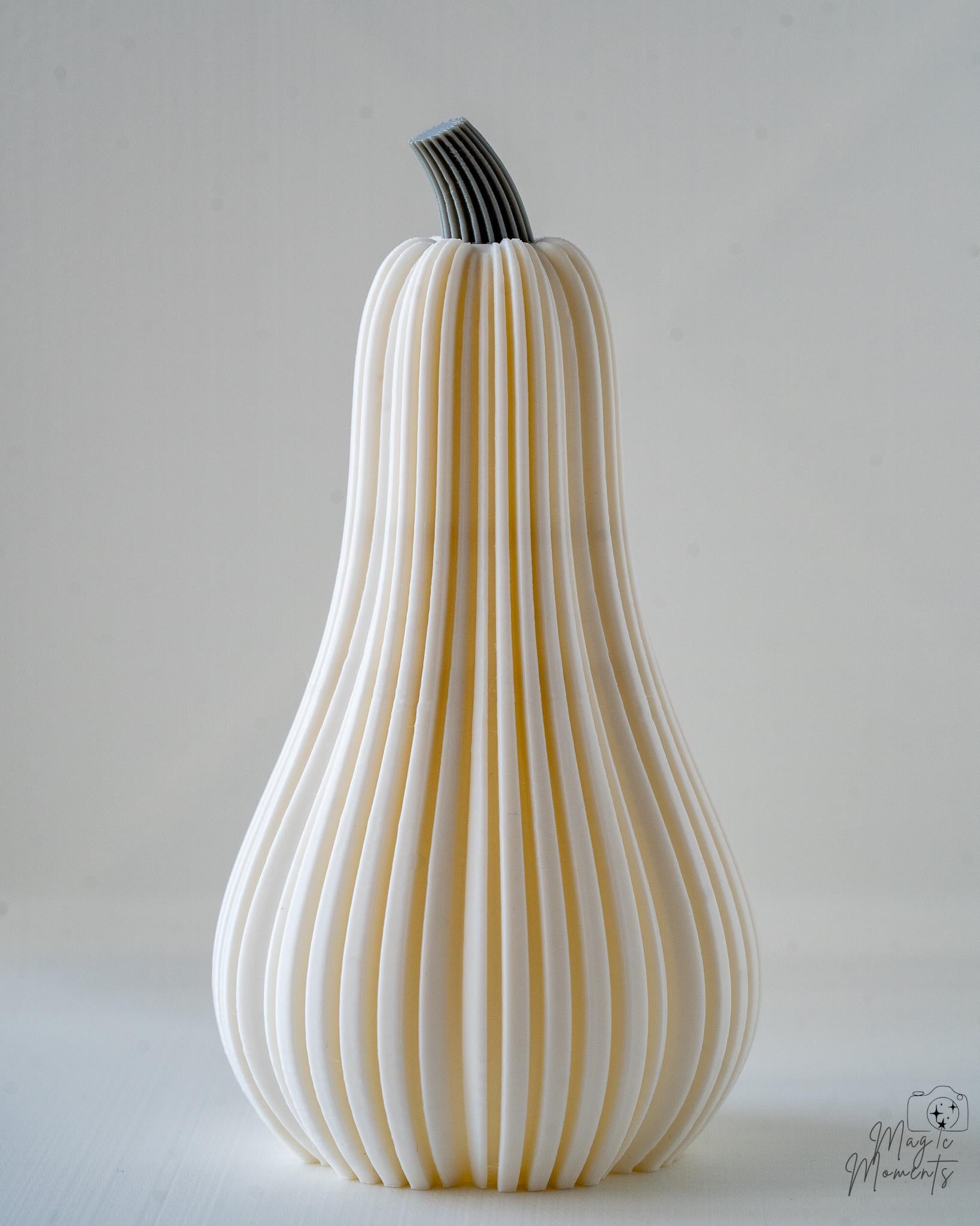 Decorative white pumpkin with ribbed texture