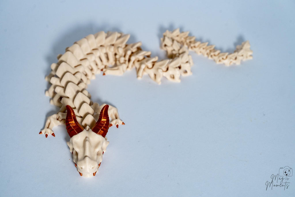 Bone dragon fantasy figure with metallic horns