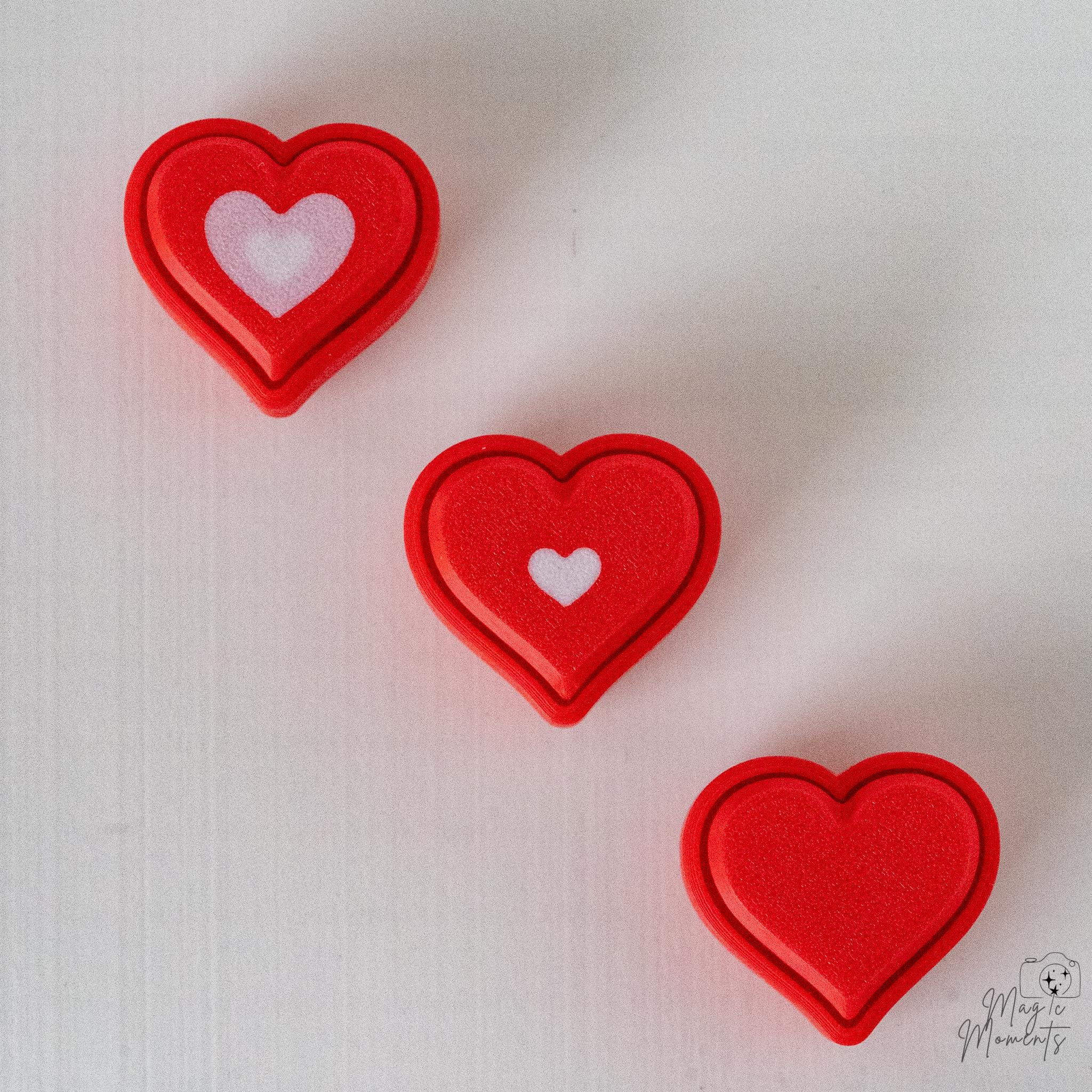 Mini heart clickers with red and white Valentine style details