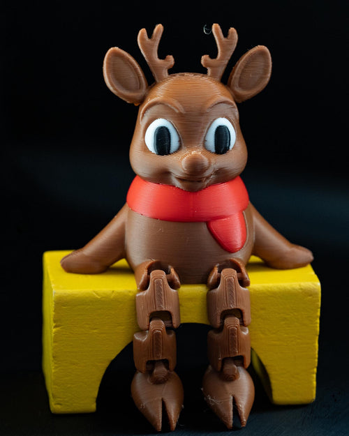 Reindeer Christmas shelf sitter decoration with scarf and hanging legs
