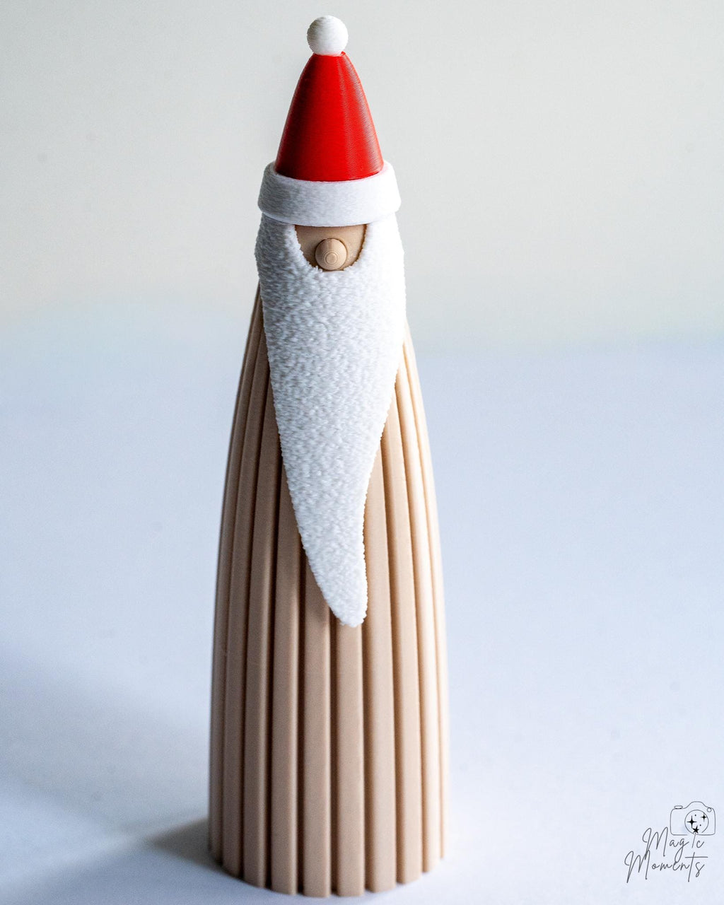 Modern Santa Claus figure with long white beard and red hat