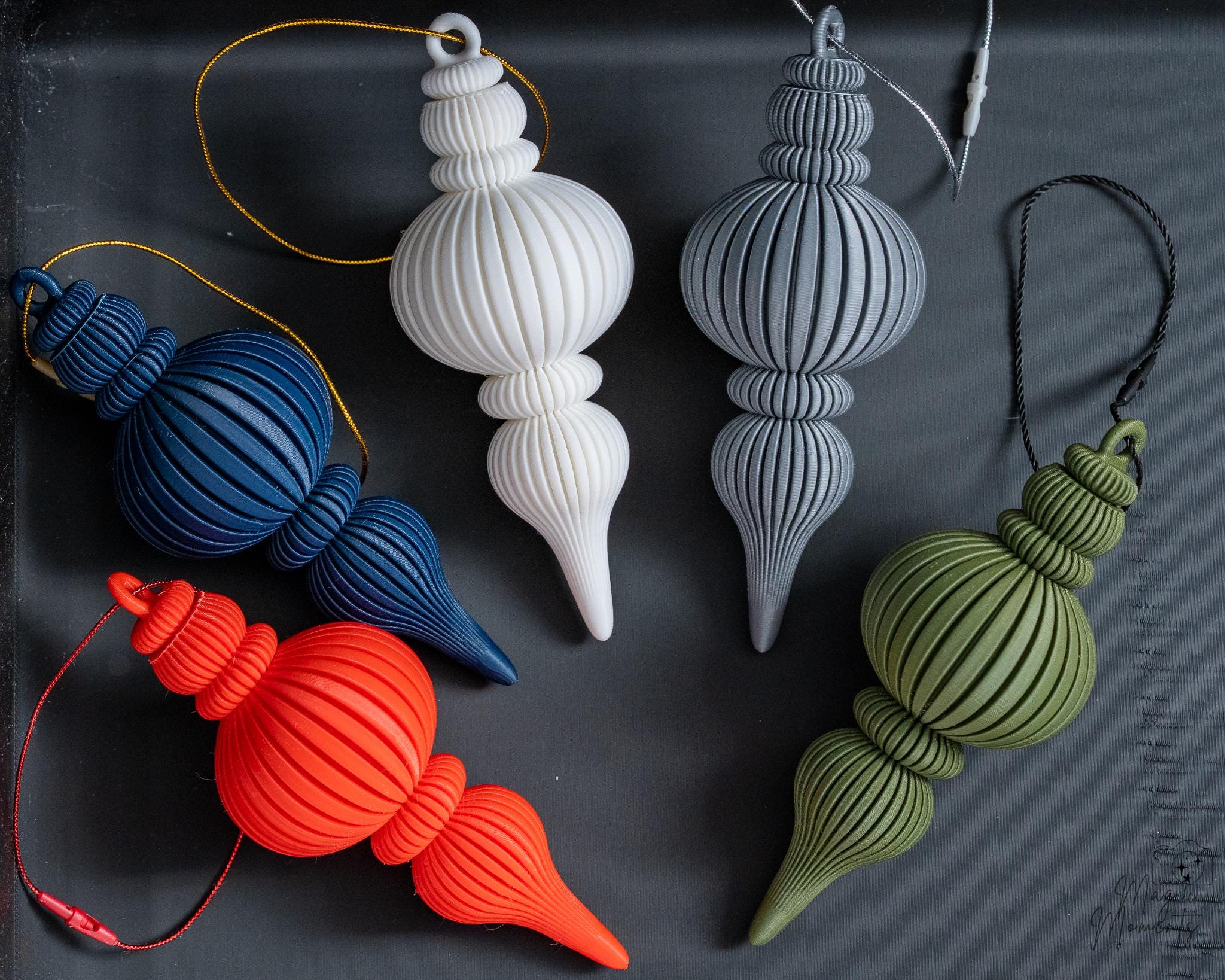 3D printed hanging Christmas ornaments in red blue white grey and green colours