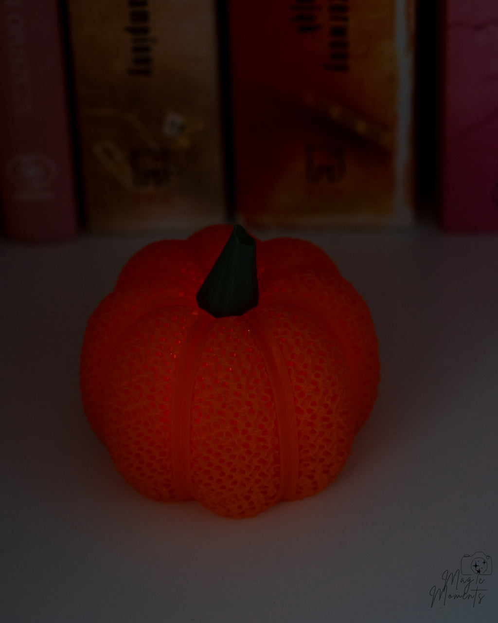 Textured mesh pumpkin glowing with LED tealight candle