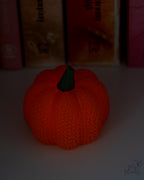 Textured mesh pumpkin glowing with LED tealight candle