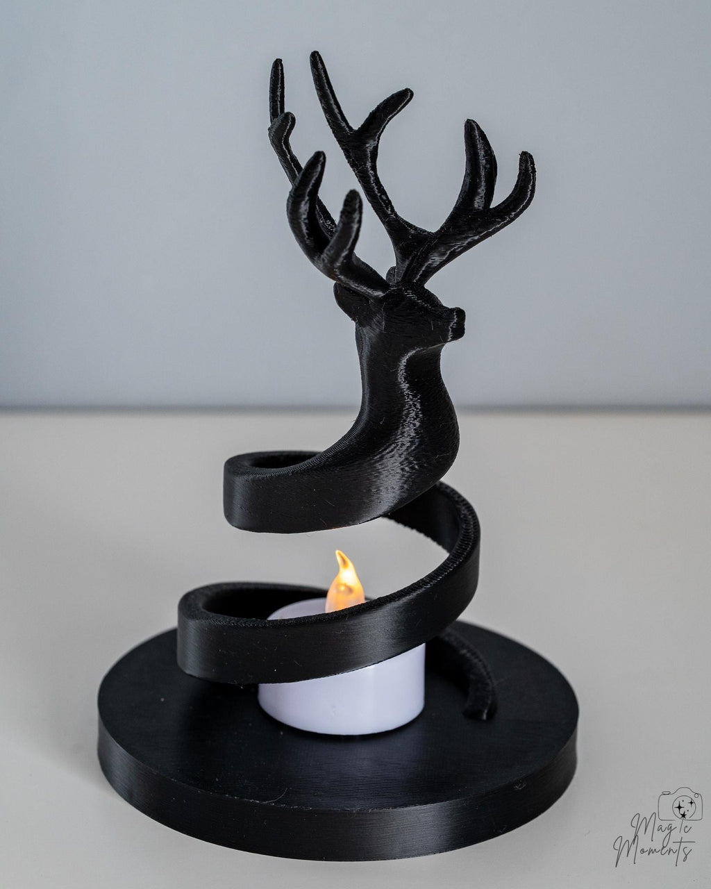 black deer tealight holder with minimalist spiral base