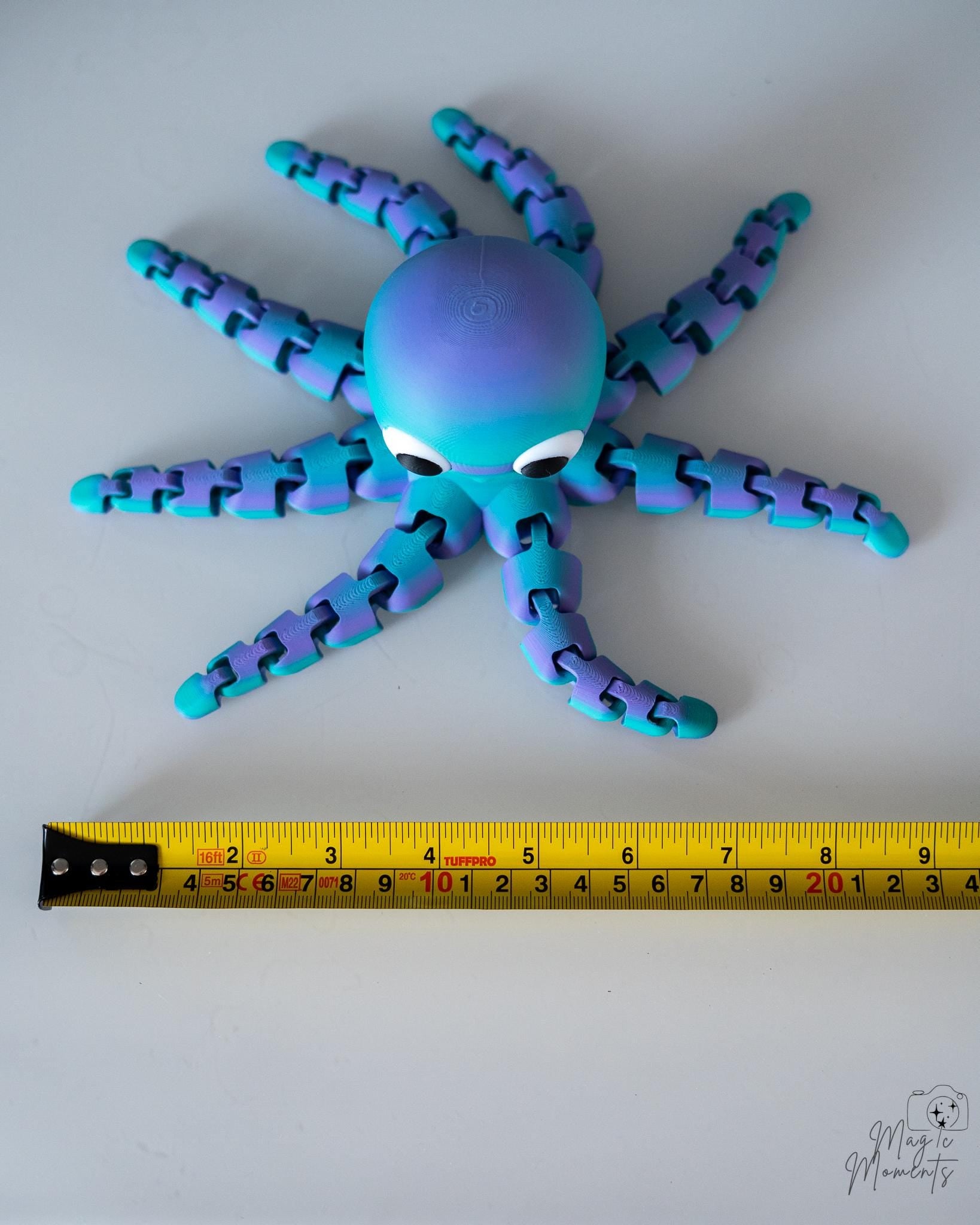 Octopus figure next to measuring tape for scale