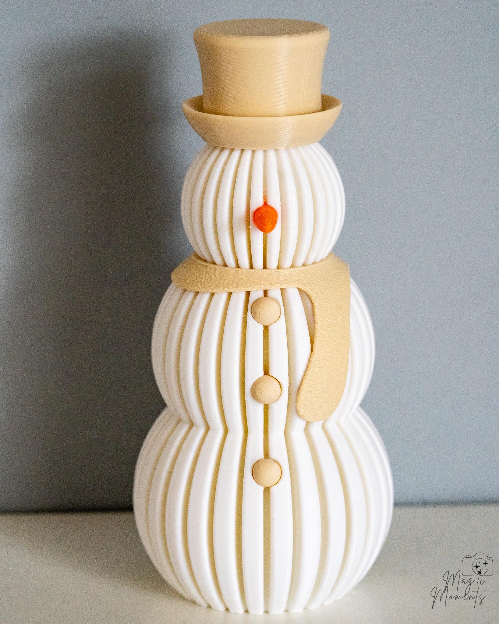 Beige scarf snowman decoration with warm glowing effect