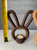 Brown bunny ear tealight holder next to measuring tape for scale