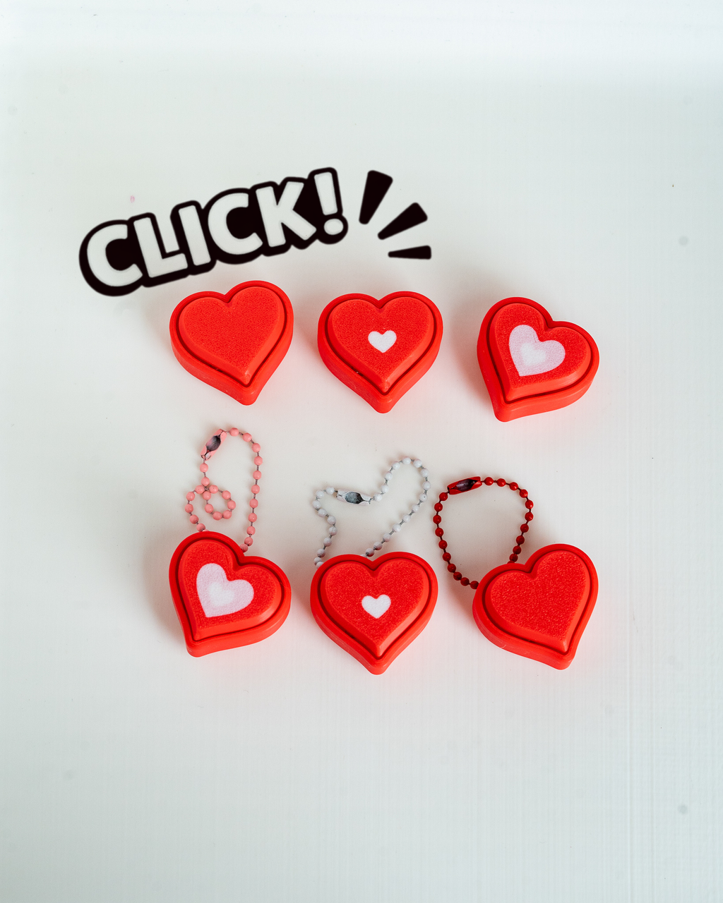 3D printed heart clicker set with hanging loop keychain designs