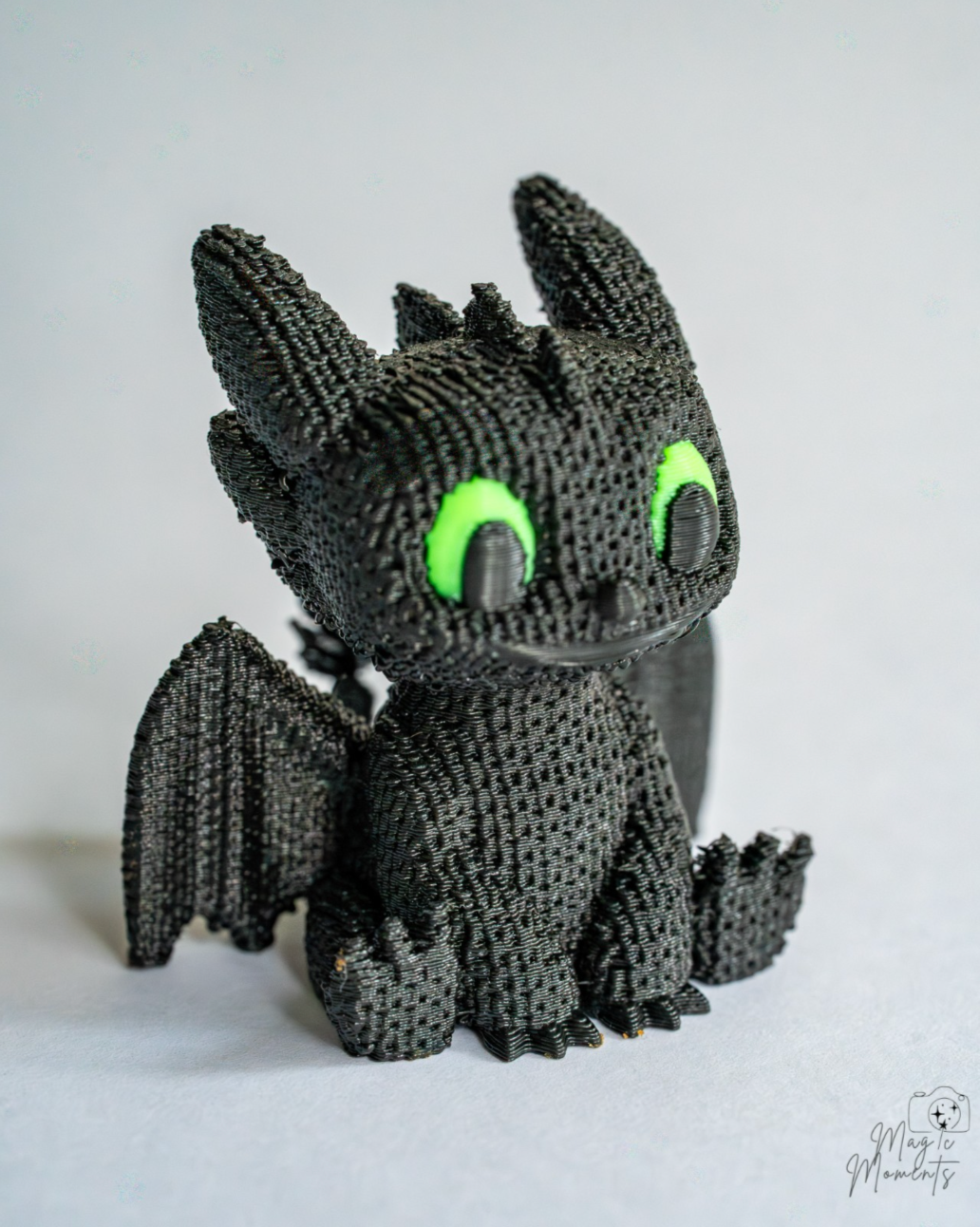 Night Fury inspired dragon figure with green eyes