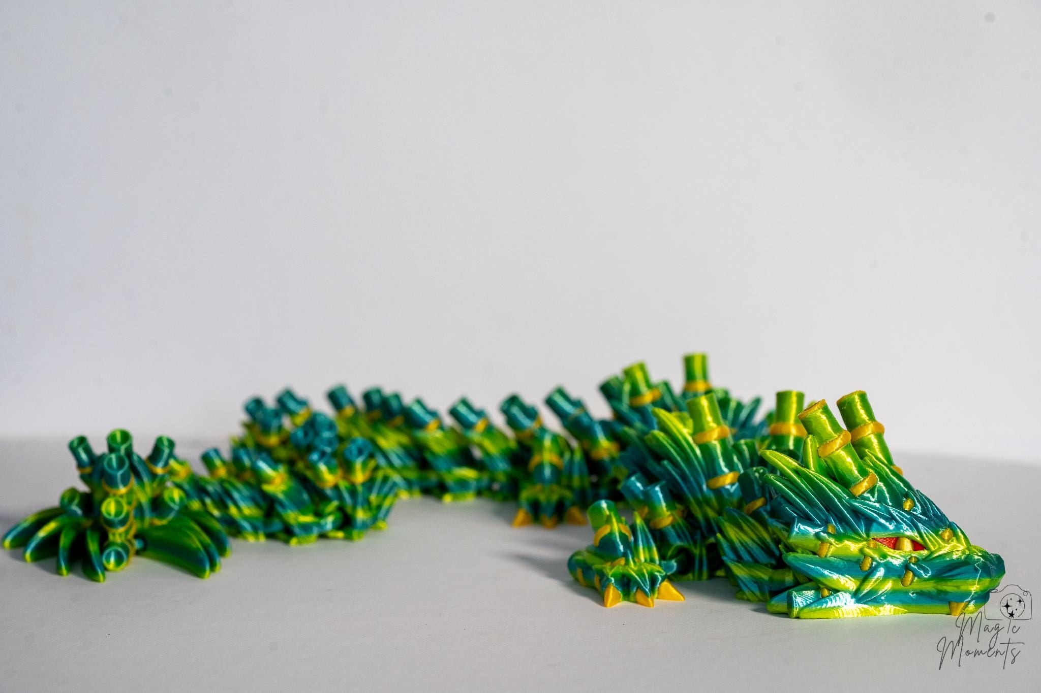 3D printed bamboo dragon decoration with detailed spike texture and flexible body