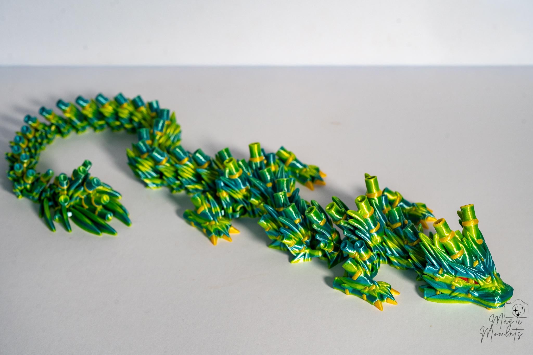 Flexible bamboo dragon figure with layered fantasy scales