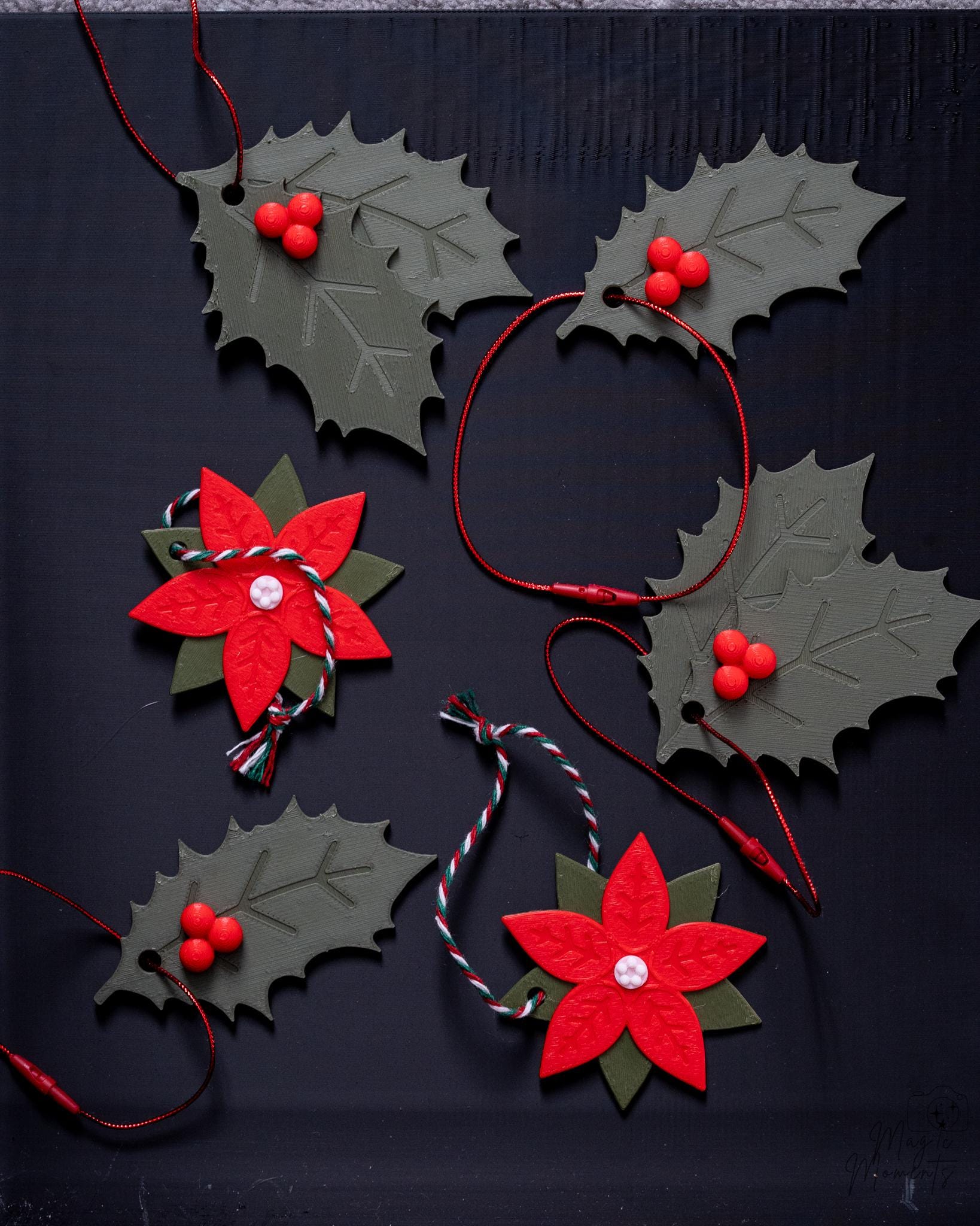 Christmas ornament set with holly leaves and poinsettia flower designs