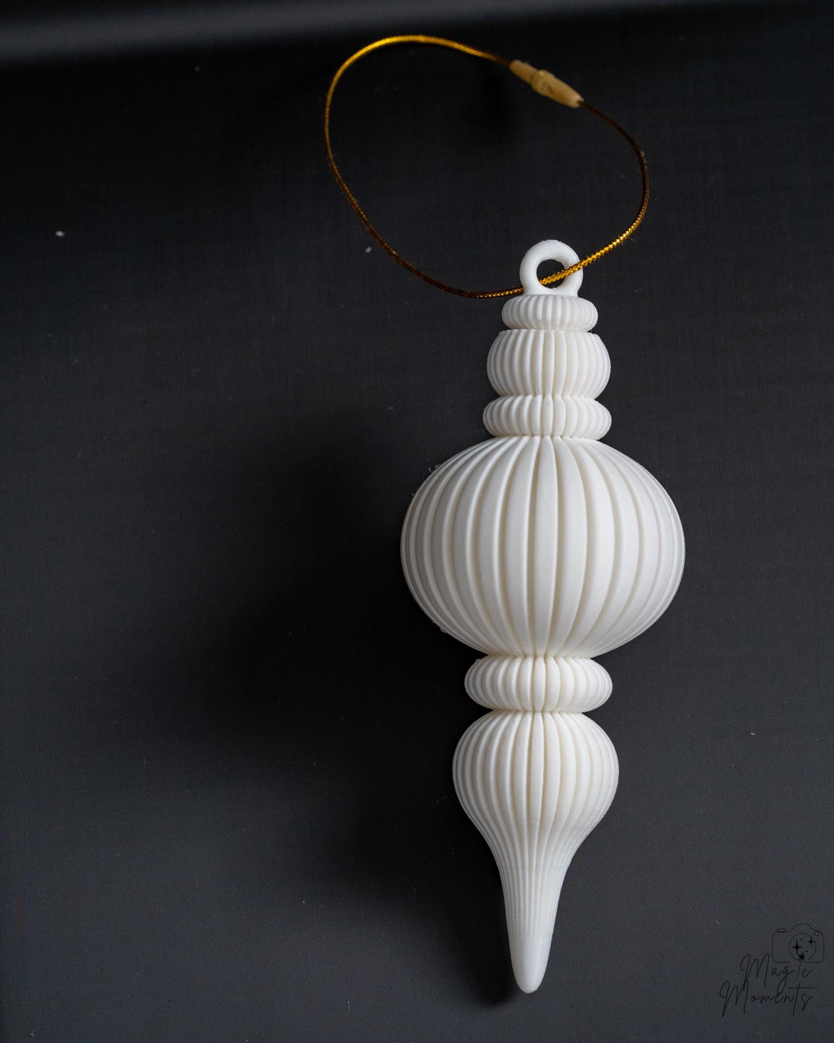White ribbed Christmas ornament with elegant layered design