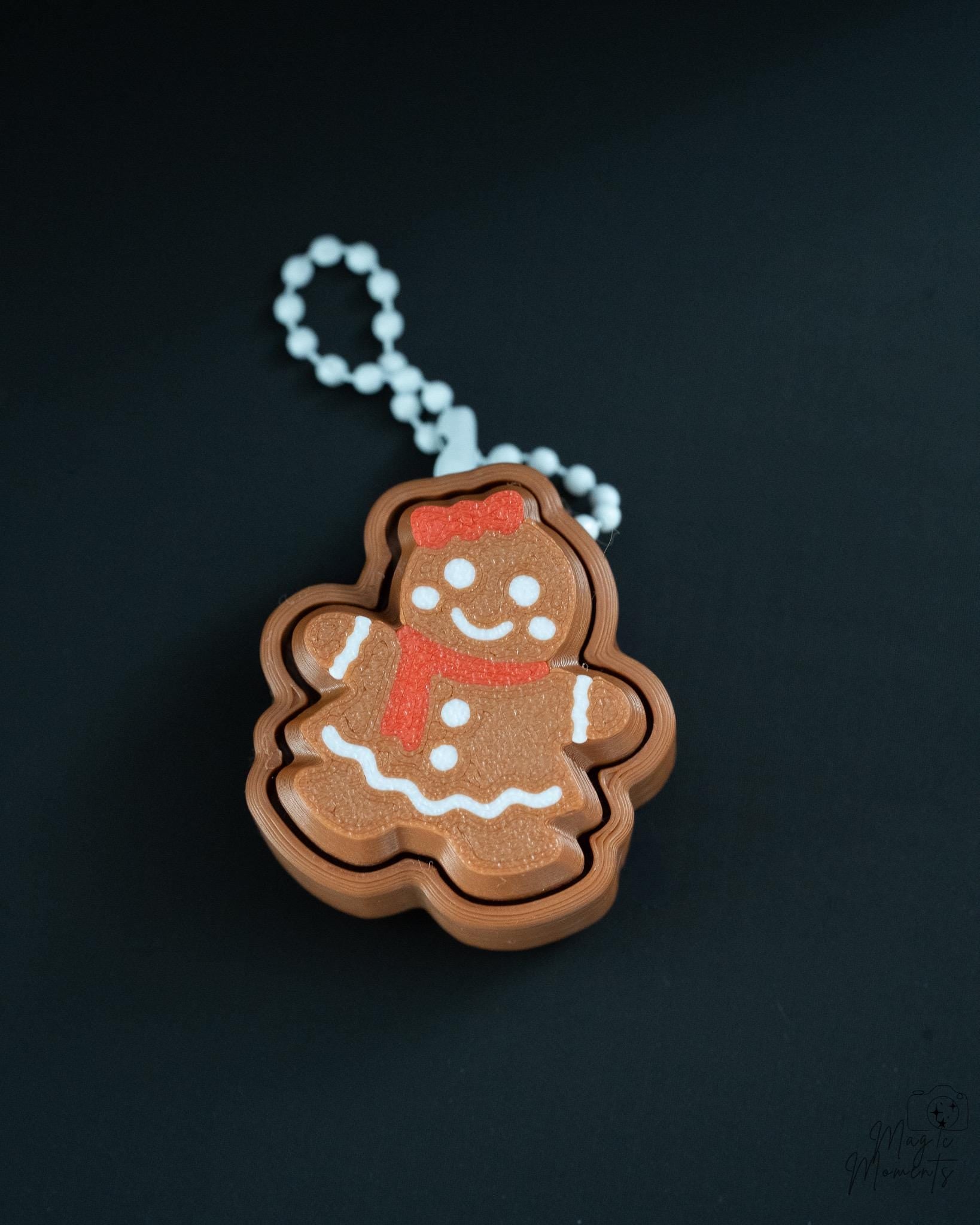 Gingerbread clicker with silver hanging loop and festive icing pattern