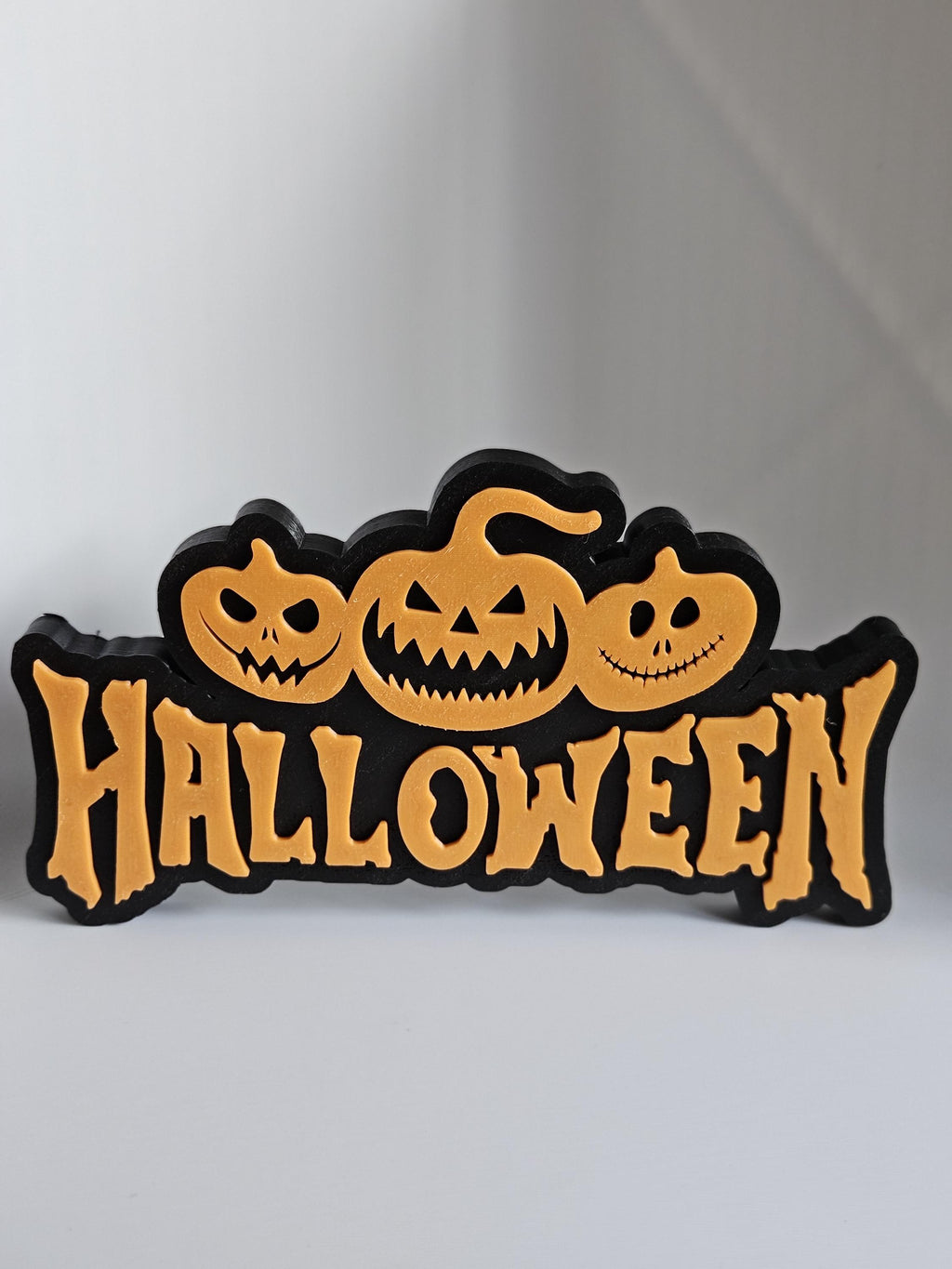 3D printed Halloween display sign in black and orange