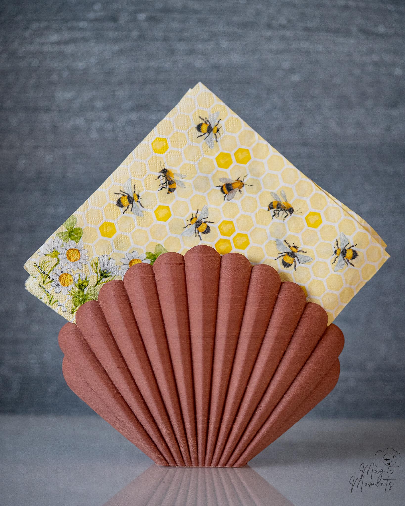 brown shell napkin holder with napkins