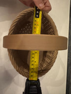 brown woven basket depth next to measuring tape for scale