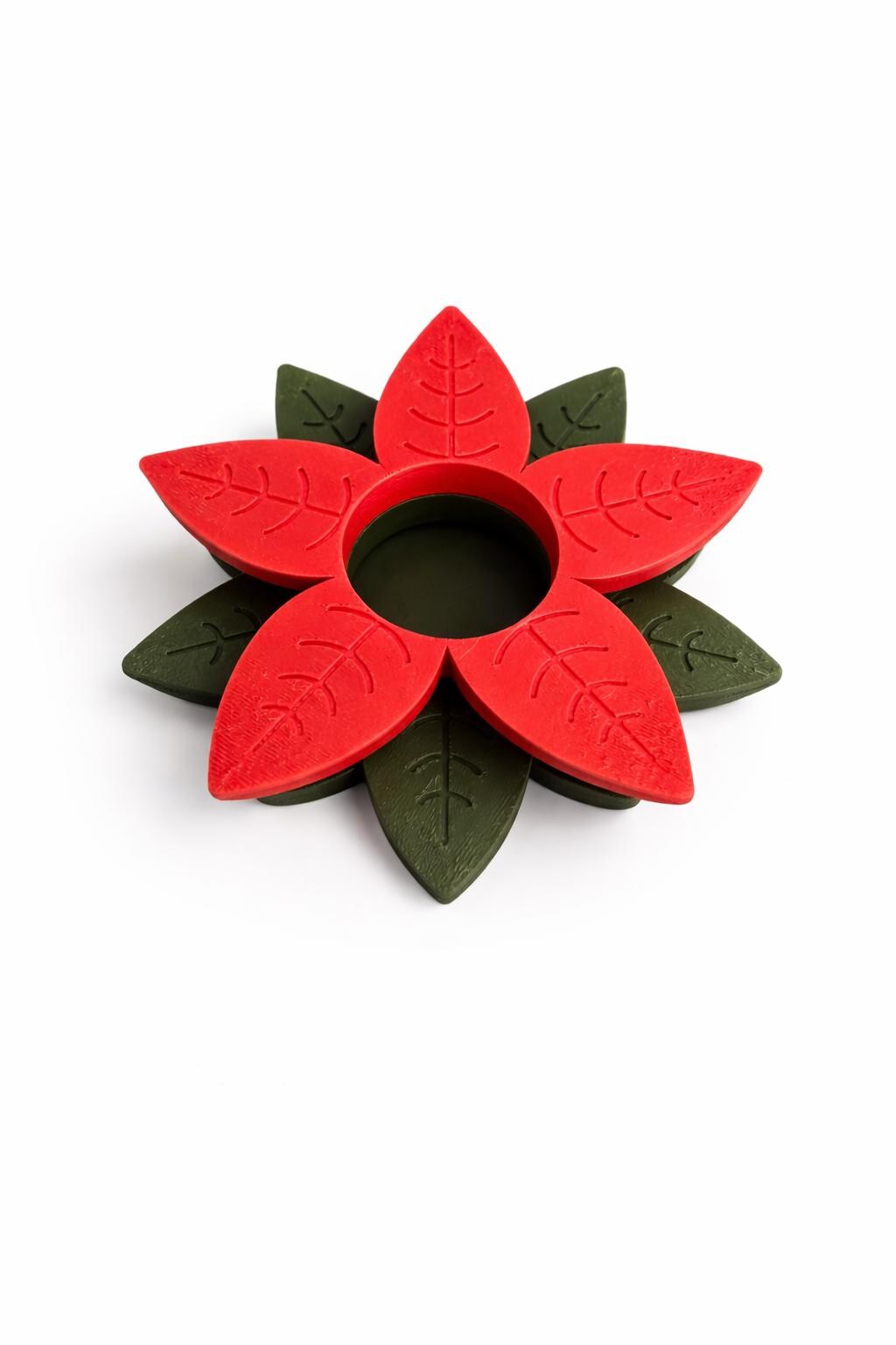 Red poinsettia tealight holder with detailed leaf design for LED candles