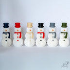 Set of six decorative snowmen with different colored hats and scarves on a white background.