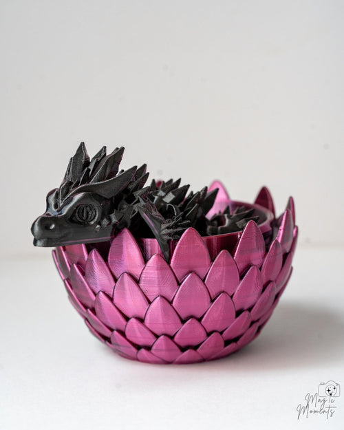pink and black dragon egg with dragon