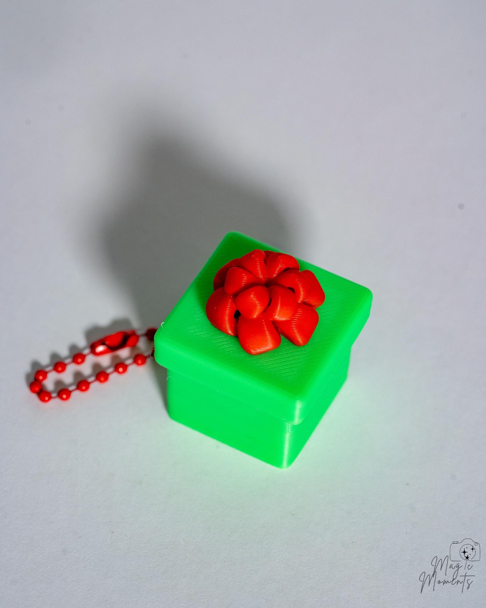 green christmas present clicker keychain