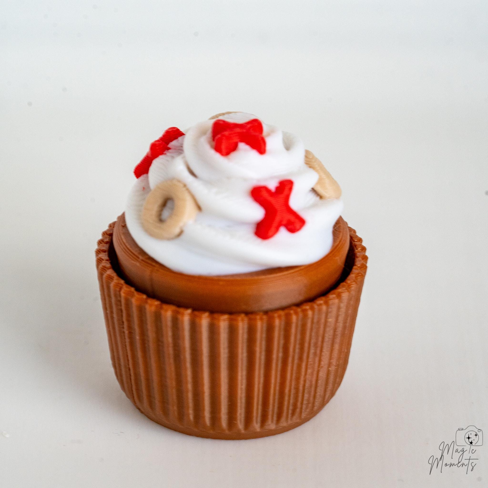 Valentine cupcake clicker with whipped cream and sprinkle decoration
