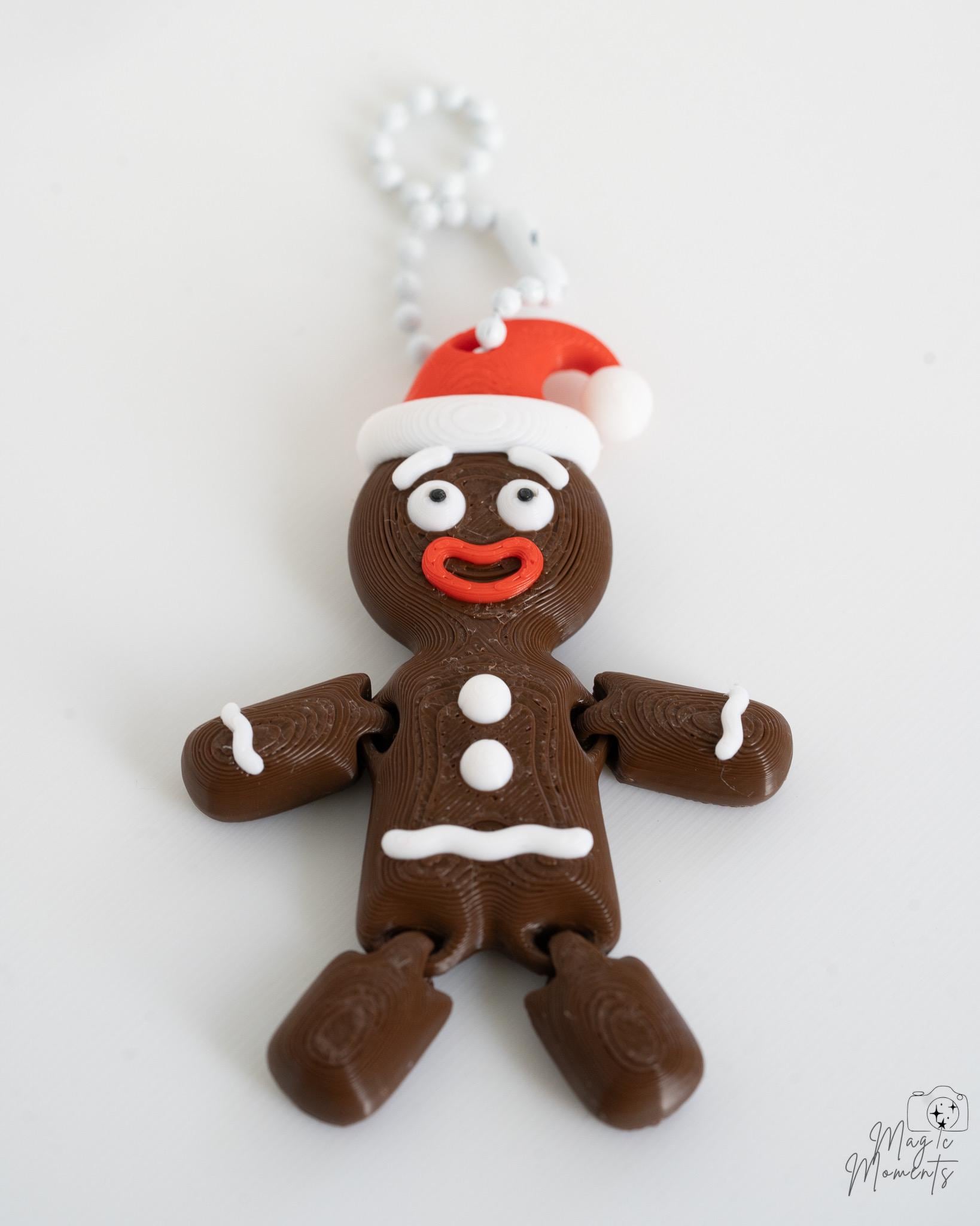 Dark brown gingerbread ornament with festive icing details