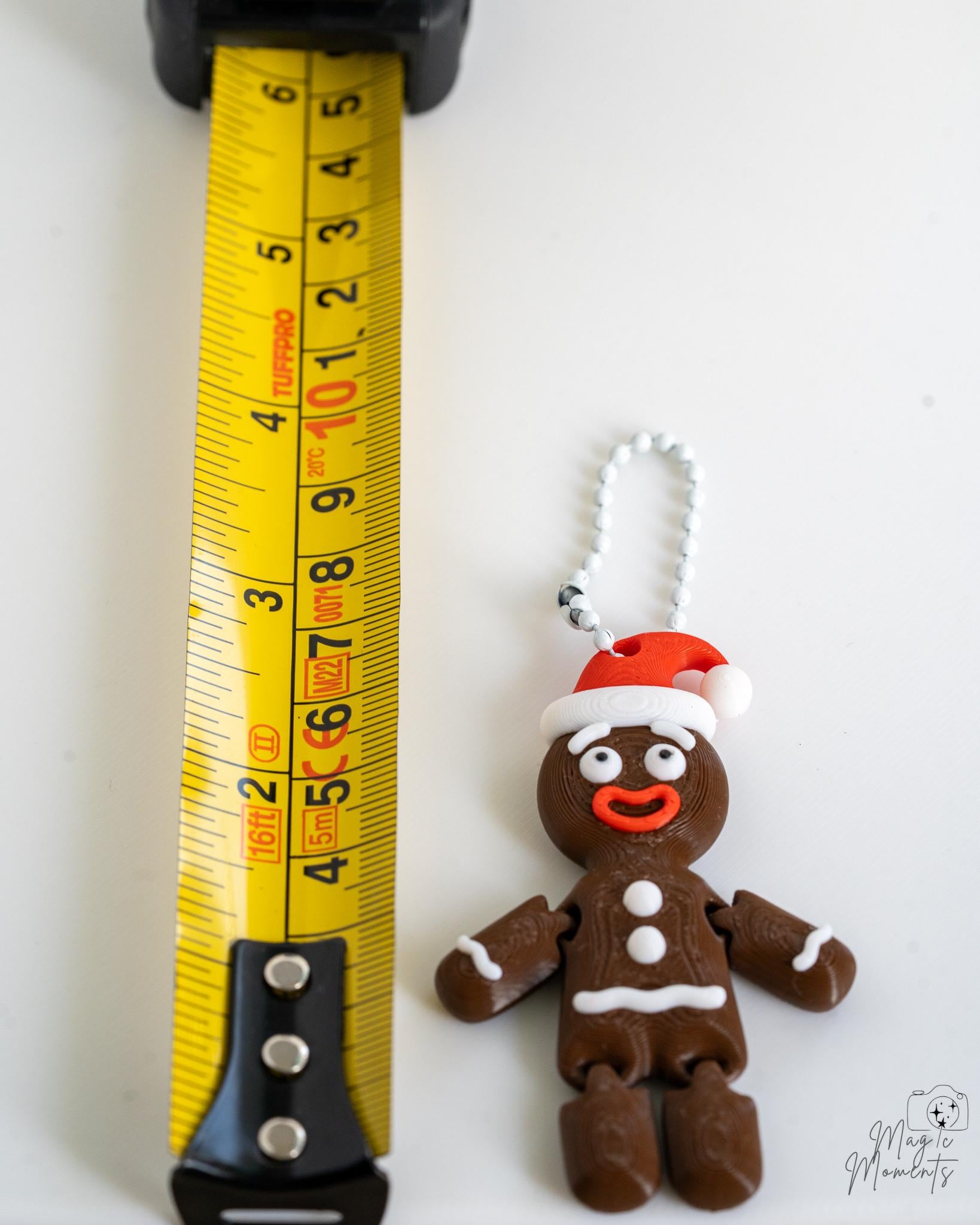Gingerbread ornament next to measuring tape for scale