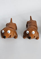Brown puppy figures side by side