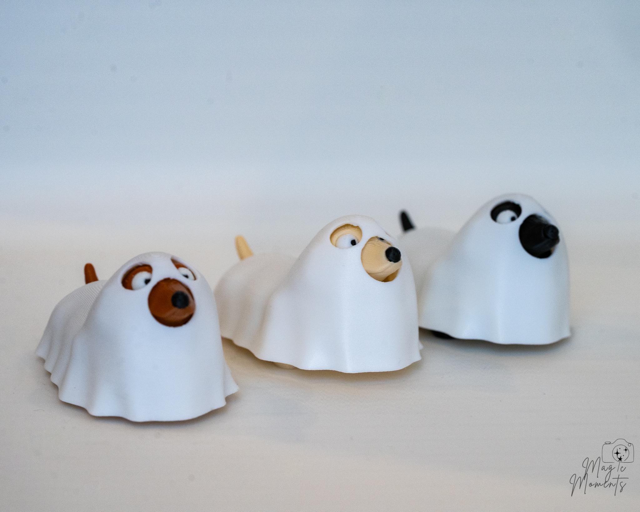 Ghost dog figures displayed in a row