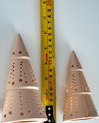 christmas tree tealight holders next to measuring tape for scale