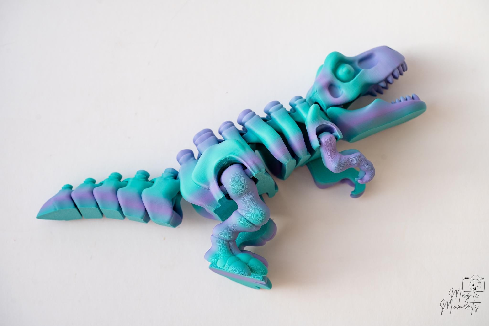 Articulated T-Rex skeleton figure in multicolour filament