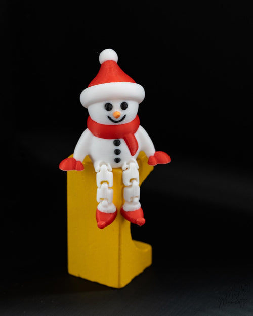 Snowman Christmas shelf sitter with festive winter design and hanging legs