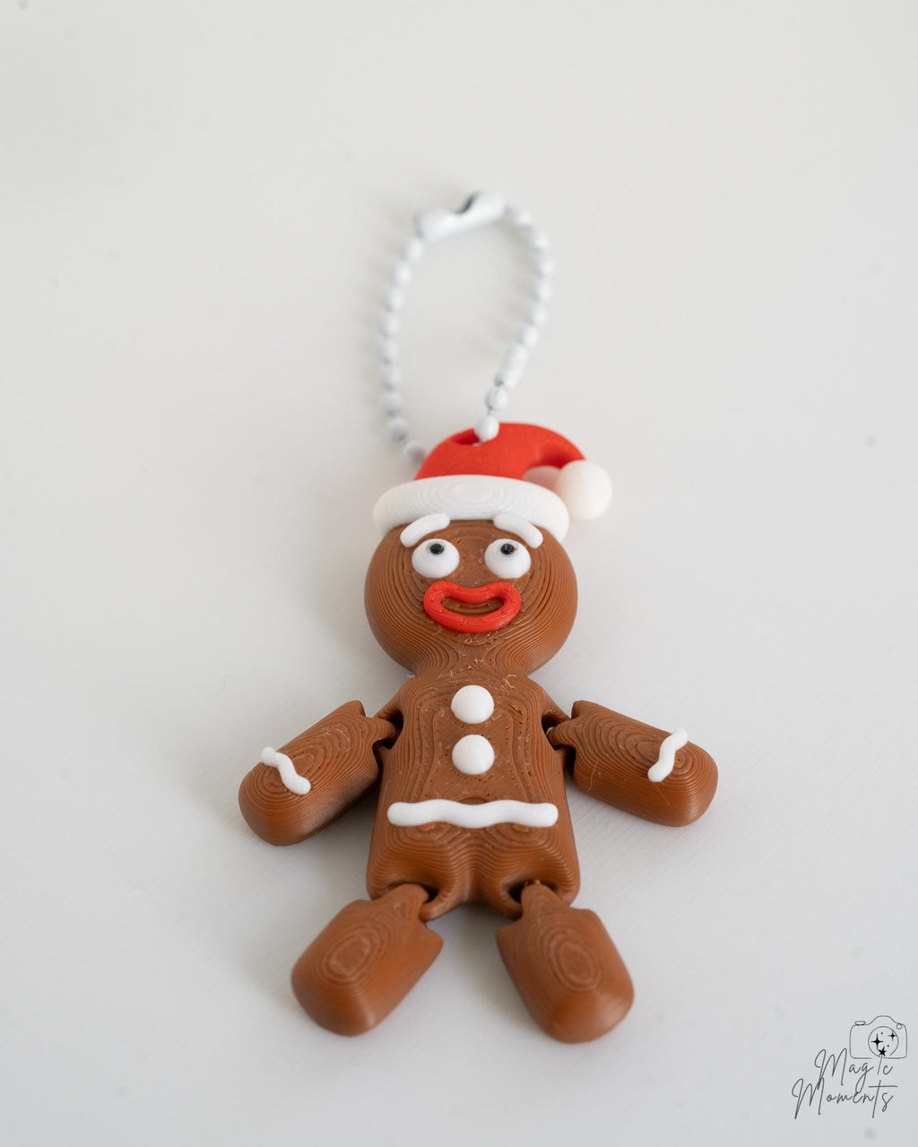 Light brown gingerbread ornament with Santa hat and hanging loop