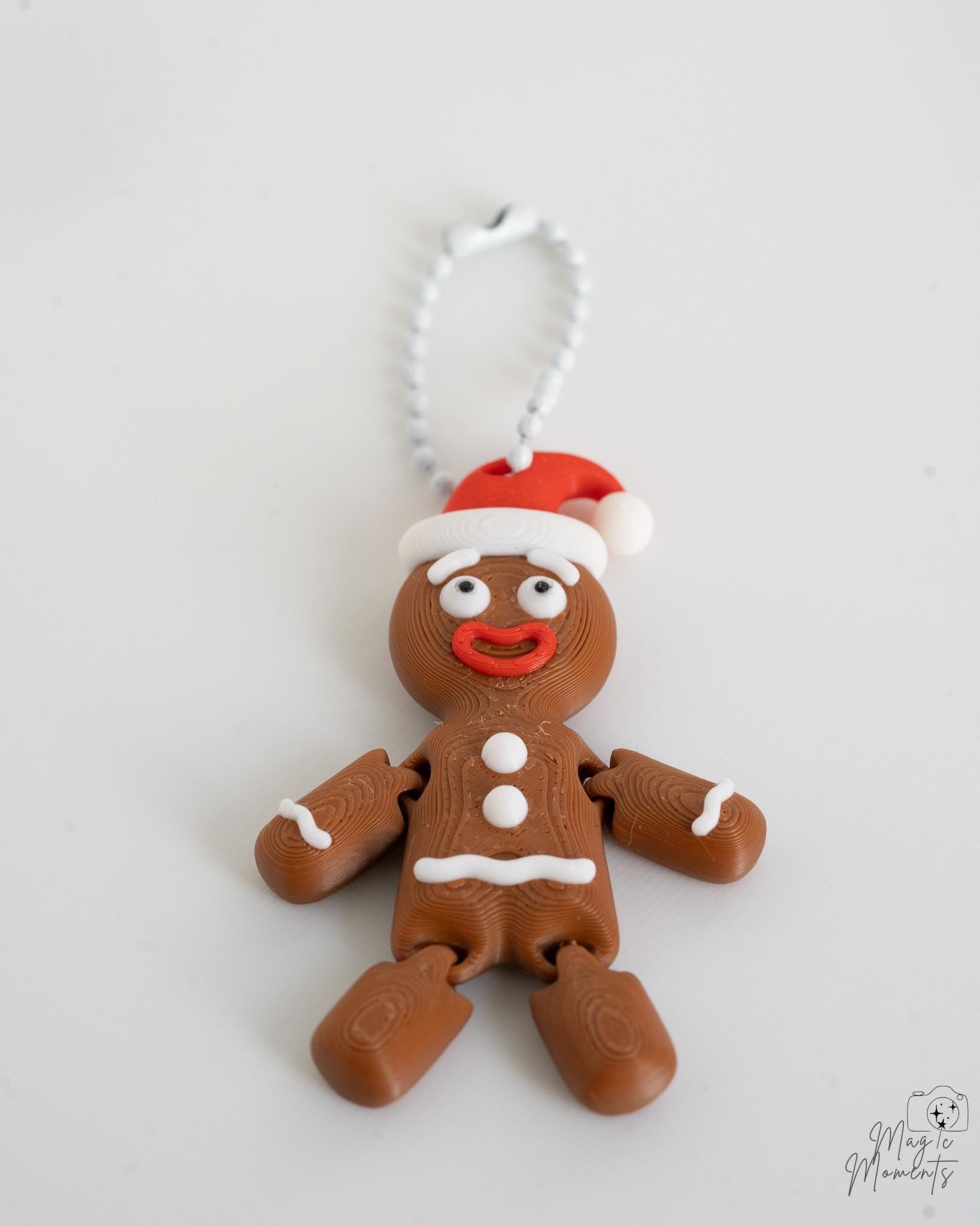 Light brown gingerbread ornament with Santa hat and hanging loop