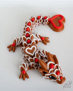 Flexible articulated dragon with red heart tail and decorative scales